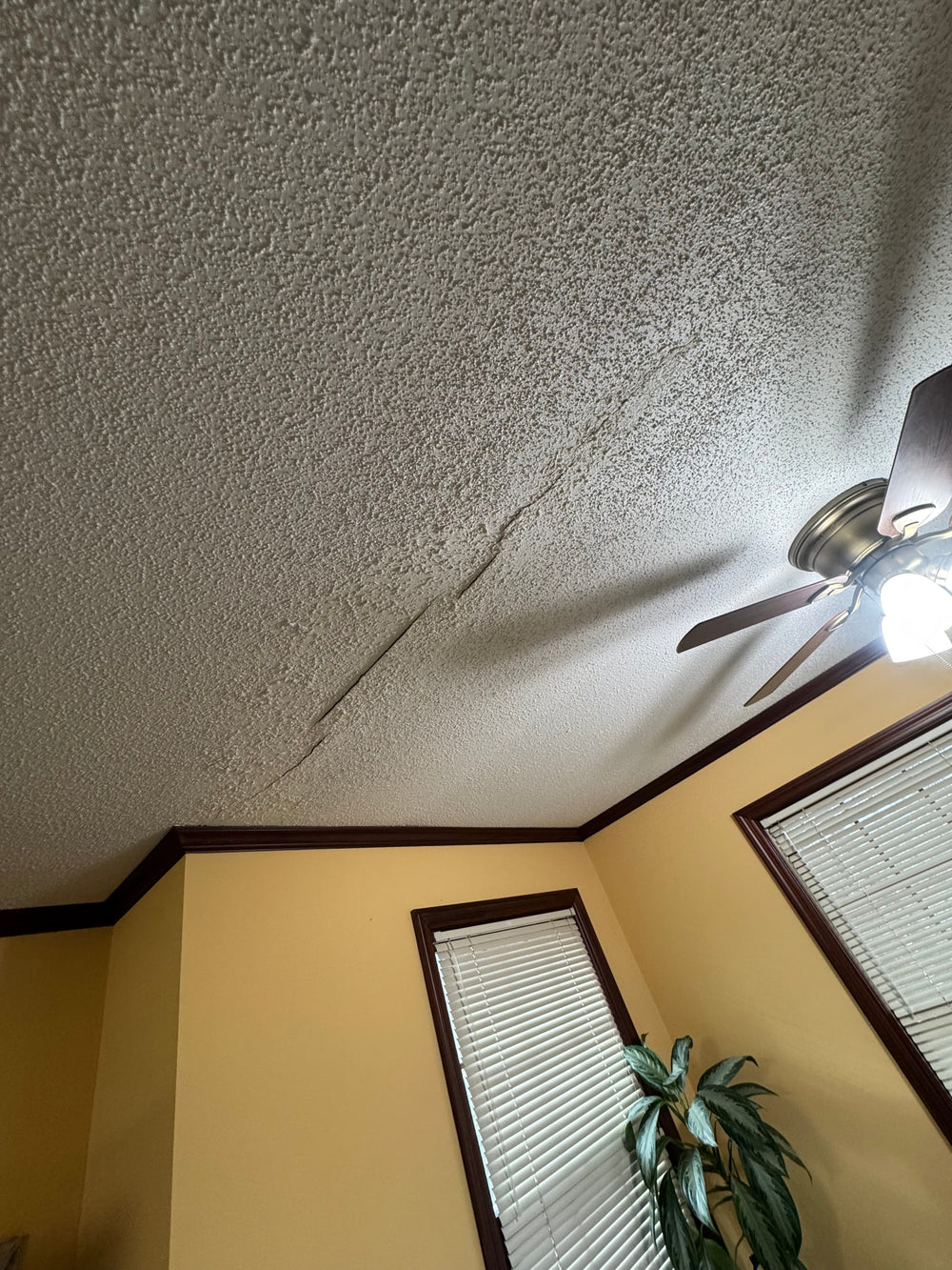 That Ceiling Crack Isn’t Just Cosmetic — Here’s What It Means (and How to Fix It)